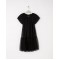Drop waist dress with cap sleeves and a sparkling tulle overlay.