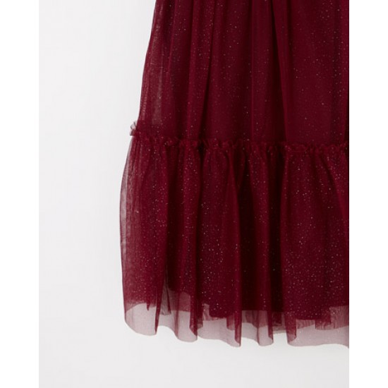 Drop waist dress with cap sleeves and a sparkling tulle overlay.